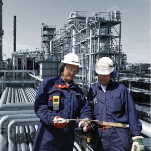 refinery workers inside oil and gas installation refinery workers inside oil and gas installation