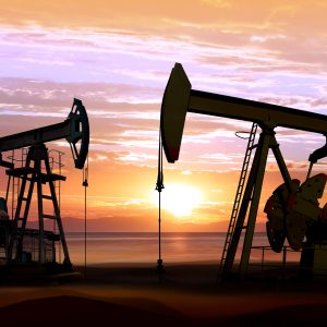 Oil pumps on sunset Silhouette of working oil pumps on sunset background